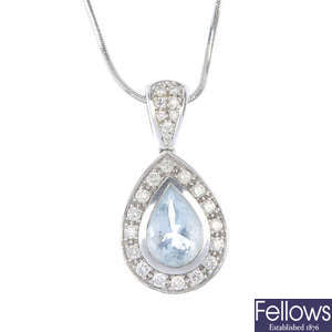 An aquamarine and diamond cluster pendant.