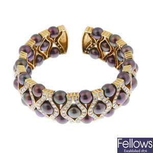 A stained cultured pearl and diamond flexible cuff. 