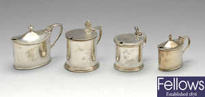 A late Victorian silver mustard pot & three later examples.(4).