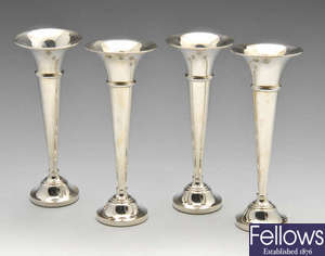 Six modern silver vases with filled bases.