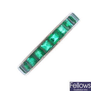 A mid 20th century 18ct gold emerald full-circle eternity ring.