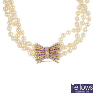 A cultured pearl three-row necklace, with ruby and diamond clasp.