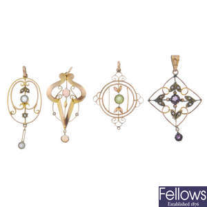 A selection of four early 20th century 9ct gold gem-set pendants.