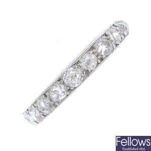 A mid 20th century platinum diamond full-circle eternity ring. 