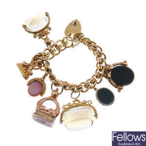 A 9ct gold bracelet and seven fobs. 