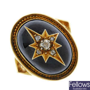 A mid 19th century gold garnet and diamond ring.