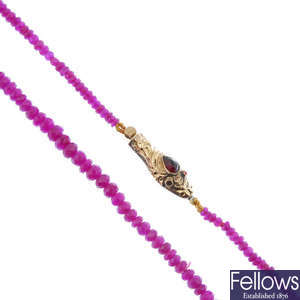 A faceted ruby bead necklace, with mid 19th century gold snake clasp.