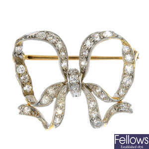 A diamond set bow brooch. 