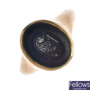 An early 20th century gold hardstone intaglio ring.