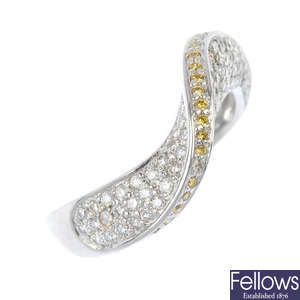 A 'yellow' diamond and diamond dress ring.