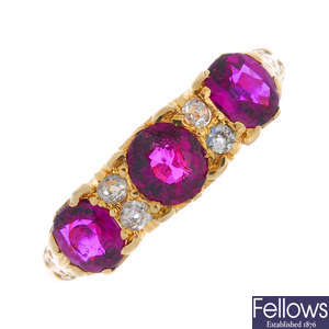 An early 20th century gold ruby and diamond three-stone ring.