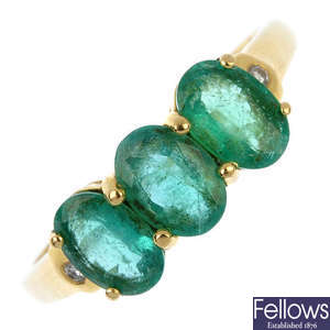 An 18ct gold emerald three-stone ring.