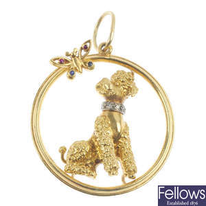 KUTCHINSKY - a 1960s 18ct gold gem-set poodle pendant. 