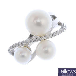 An 18ct gold cultured pearl and diamond dress ring. 