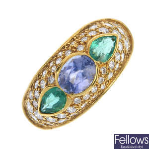 A sapphire, emerald and diamond dress ring.