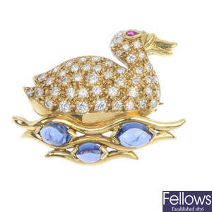 An 18ct gold diamond, sapphire and ruby duck brooch.