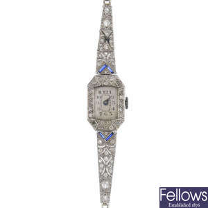 A lady's early 20th century platinum diamond and synthetic sapphire cocktail watch.