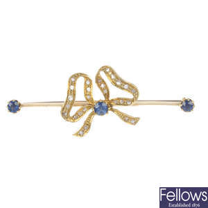 A sapphire and diamond bow brooch.