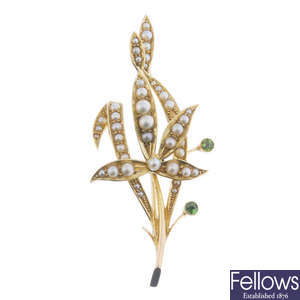 An early 20th century 15ct gold seed, split pearl and demantoid garnet brooch.