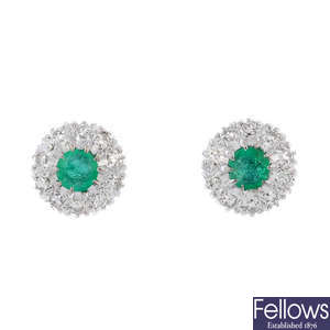 A pair of emerald and diamond cluster ear studs.