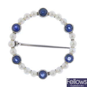 An early 20th century sapphire and seed pearl wreath brooch.