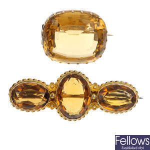 Two early 20th century gold citrine brooches.