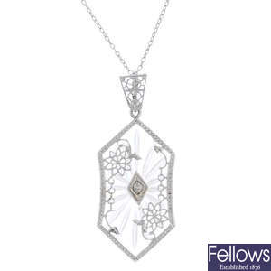 A diamond and rock crystal pendant.