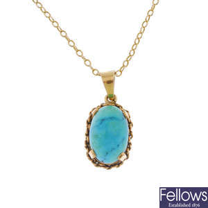 A turquoise pendant.