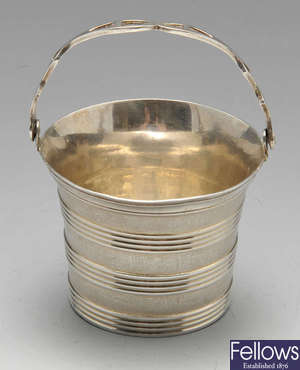 A George III silver cream pail by Thomas Heming.