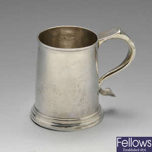 A George I silver half pint mug.