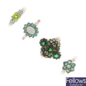 A selection of four gem-set rings.