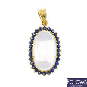 A moonstone and sapphire pendant.