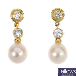 A pair of 18ct gold diamond and cultured pearl ear pendants. 