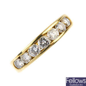 An 18ct gold diamond half-circle eternity ring. 