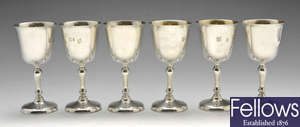 A set of six modern silver goblets.