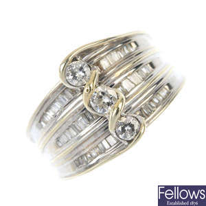 A diamond three-stone dress ring. 