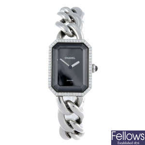 (538092-7-A) CHANEL - a lady's stainless steel bracelet watch with two other watches.
