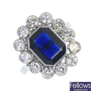 A mid 20th century platinum, sapphire and diamond cluster ring.
