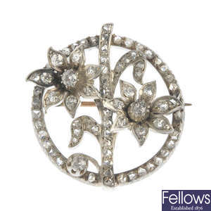 An early 20th century silver and gold diamond floral brooch.