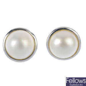 A mabe pearl pendant and earring set.
