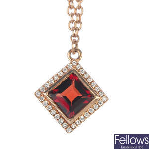 A garnet and diamond cluster pendant.