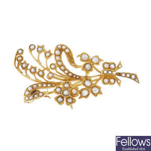 An early 20th century 15ct gold split pearl floral brooch.