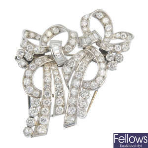 A diamond double clip brooch.