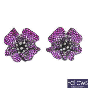 A pair of sapphire and diamond floral earrings.