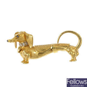 A 1960s 18ct gold diamond and sapphire dachshund brooch.