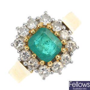 A mid 20th century 18ct gold emerald and diamond cluster ring.