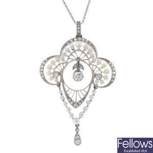 An early 20th century platinum and gold, diamond and seed pearl pendant.