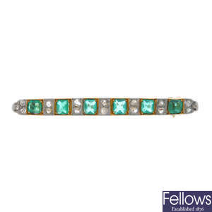 An early 20th century emerald and diamond brooch.