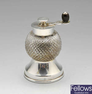 A 1920's silver mounted and glass pepper grinder.