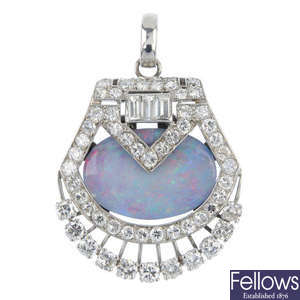 An opal doublet and diamond pendant.